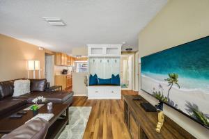 a living room with a couch and a table at Beautiful & Cozy Home on a Canal in Hudson, FL! in Hudson