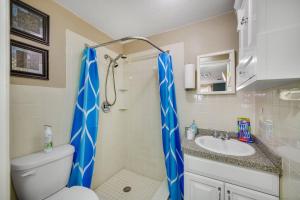 a bathroom with a toilet and a sink at Beautiful & Cozy Home on a Canal in Hudson, FL! in Hudson +83 photos
