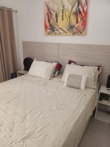 Кровать или кровати в номере Pipa Solar Água 150