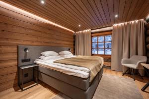 Postel nebo postele na pokoji v ubytování Saariselkä Kelo Lodge