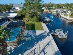 a view of a marina with boats in the water at Cozy Oasis Screened Pool Picturesque Water Canal Views! in Port Richey