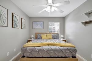 a bedroom with a bed with a ceiling fan at Pool Waterfront Lake 12 PPL Gorgeous in Riverview +76 photos