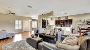 a living room with a couch and a table at Valrico's Hidden Gem A Stunning 3-Bedroom Oasis Awaits! in Valrico