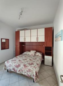 En eller flere senge i et værelse på Casa Marina