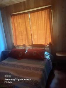 En eller flere senge i et værelse på Hermosa Casa Lican Ray