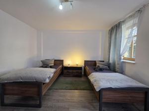 Postel nebo postele na pokoji v ubytování Mikra Homes24 in Glauchau