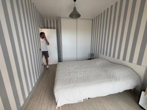 En eller flere senge i et værelse på Chambre avec balcon vue mer