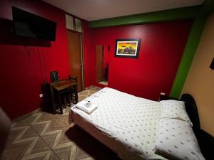 Postel nebo postele na pokoji v ubytování Hostal Nocheros