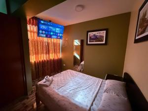 Postel nebo postele na pokoji v ubytování Hostal Nocheros