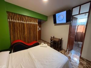 Postel nebo postele na pokoji v ubytování Hostal Nocheros