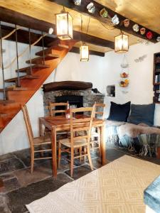 a living room with a table and chairs and a couch at Casa Mönä in Corippo +16 photos