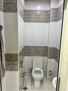 a bathroom with a toilet and a sink at Apartment city in Baku
