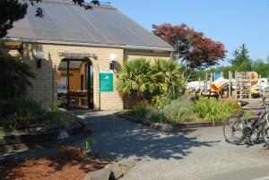 a building with a bike parked in front of it at Seaside Camping Resort Studio Cabin 4 in Seaside