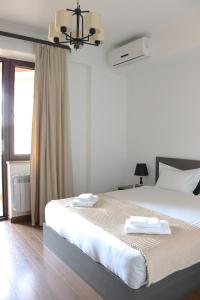 Giường trong phòng chung tại Domel Yerevan Buzand 17 +29 ảnh