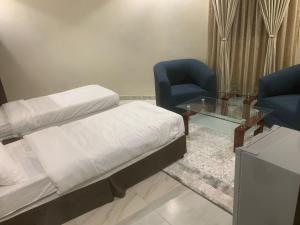 Postel nebo postele na pokoji v ubytování سرايا سين للشقق المخدومة