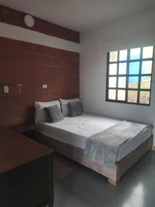 Postel nebo postele na pokoji v ubytování Mirador del alma + 1 fotografie