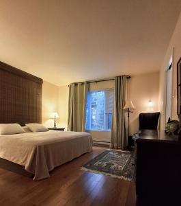 En eller flere senge i et værelse på Cottage 30 Minutes from Ottawa