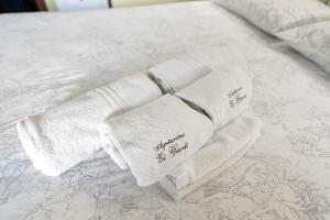 En eller flere senge i et værelse på Agriturismo El Giardì