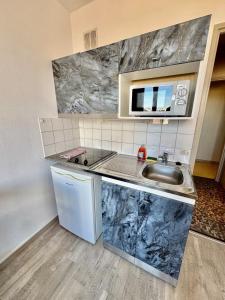 Kuchyň nebo kuchyňský kout v ubytování Hyper Centre de Valence - Studio N43