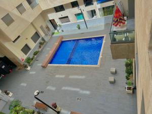 an overhead view of a swimming pool in a building at Modern Comfort Studio, la corniche in Mohammedia +6 photos