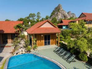 a house with a swimming pool in front of a house at Trang An ViewPoint Homestay in Ninh Binh +116 photos