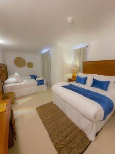 Ένα ή περισσότερα κρεβάτια σε δωμάτιο στο Bohemia Hotel Boutique