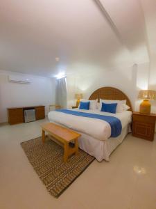 Ένα ή περισσότερα κρεβάτια σε δωμάτιο στο Bohemia Hotel Boutique