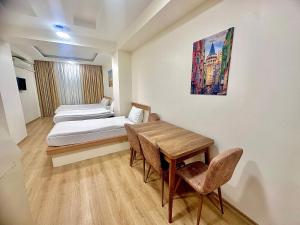 En eller flere senge i et værelse på Valence Boutique Hotel Istanbul Taksim