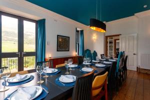 a dining room with a long table and chairs at St Marks Stays in Sedbergh