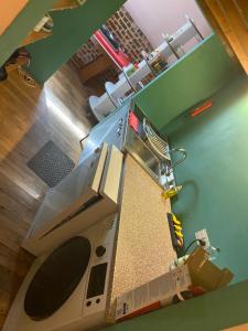 Kuchyň nebo kuchyňský kout v ubytování Chambres d'hôtes et gîtes à la ferme