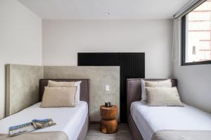 En eller flere senge i et værelse på ULIV Park Polanco