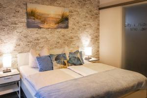 Postel nebo postele na pokoji v ubytování City Pension Stadtlohn