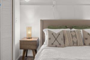 a bedroom with a bed with a clock on it at Downtown location Near the Beach Dog Friendly in Edmonds