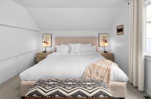 a bedroom with a large white bed and two lamps at Downtown location Near the Beach Dog Friendly in Edmonds +62 photos