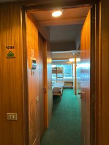 En eller flere senge i et værelse på La Dimora di Pace, adiacente alle piste per 7 persone