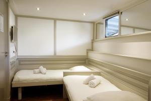 Postel nebo postele na pokoji v ubytování Kapitein Anna