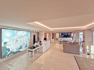 TV a/nebo společenská místnost v ubytování La Dolce Vita Hotel