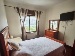 Кровать или кровати в номере Reboleira Portugal