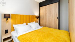 Postel nebo postele na pokoji v ubytování Apartamenty Good Time - Zloty Horyzont Resort + 24 fotografií
