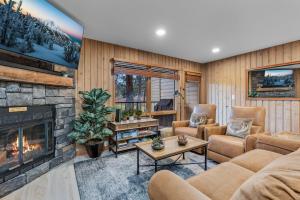 a living room with a couch and a fireplace at Bend Mt Bachelor Village Condo! in Bend