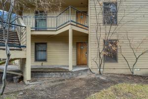 a house with a wooden door and a balcony at Bend Mt Bachelor Village Condo! in Bend