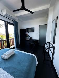 Postel nebo postele na pokoji v ubytování Lucky Monkey Inn and Restaurant