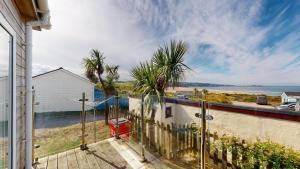 a view of the beach from the balcony of a house at C23 Wilmar, Riviere Towans in Hayle