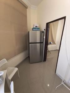 Una cocina o cocineta en KhavaQatar Hostel 2 بيت مشترك