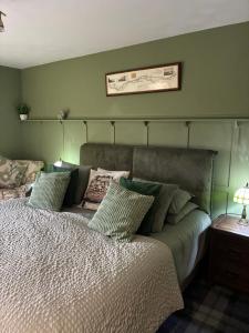 En eller flere senge i et værelse på White Side Cottage