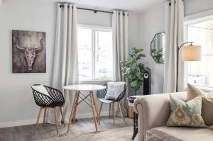 a living room with a couch and a table at Downtown location Near the Beach Dog Friendly in Edmonds