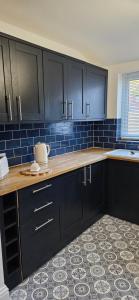 Køkken eller tekøkken på Driftwood Cottage