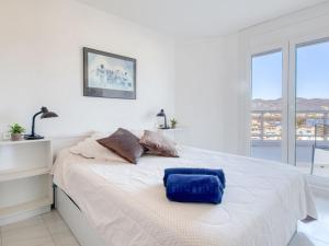 En eller flere senge i et værelse på Apartment Club Nautic-2 by Interhome