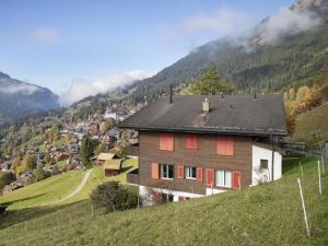 a house on the side of a hill at Apartment Tschingelhorn Apt- R by Interhome in Wengen +32 photos