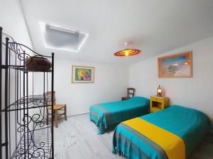 a bedroom with two beds in a room at Holiday Home Les Vidalières by Interhome in Saint-Sulpice-dʼArnoult